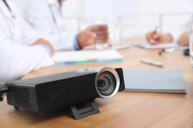 Photo of Video projector on table during medical conference