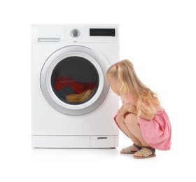 Photo of Cute little girl near washing machine with laundry on white background