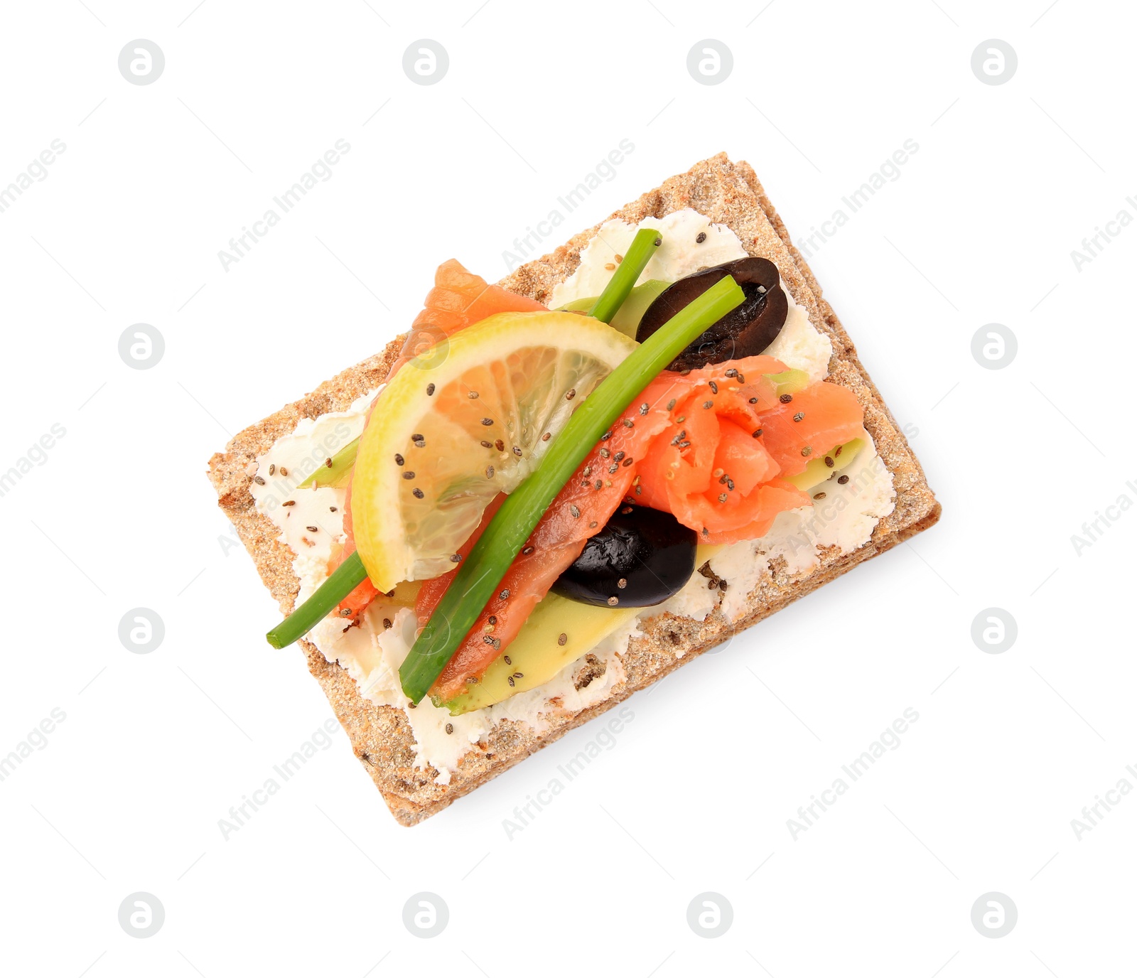 Photo of Fresh crunchy crispbread with cream cheese, salmon, olives, lemon and green onion on white background, top view