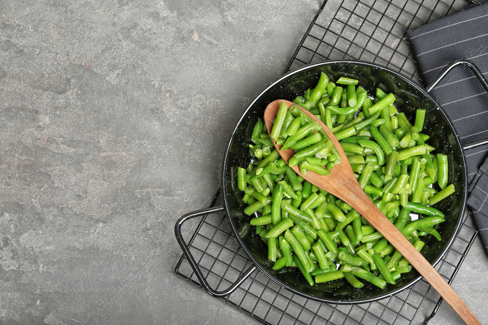 Photo of Flat lay composition with frozen green beans on grey background. Vegetable preservation