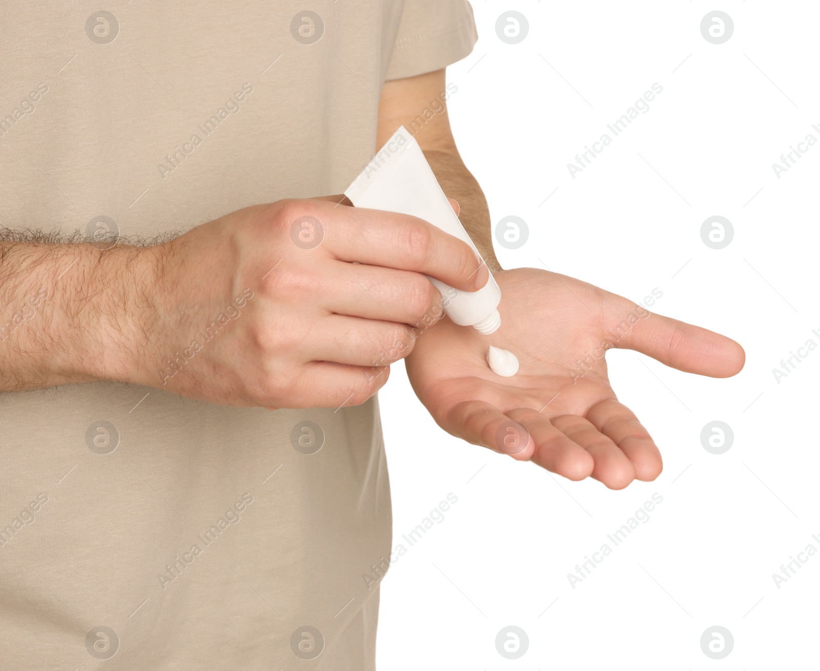 Photo of Man applying cream onto hand against white background, closeup