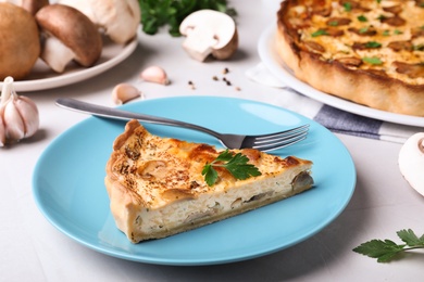 Delicious pie with mushrooms and cheese served on  light table