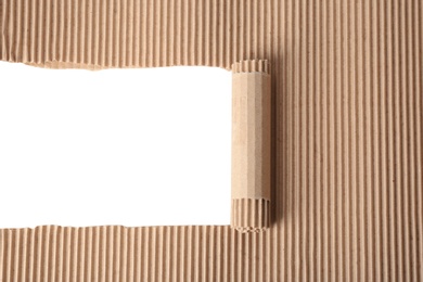 Photo of Ripped corrugated cardboard on white background. Recyclable material