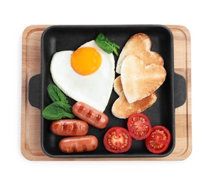 Photo of Romantic breakfast with fried sausages, heart shaped egg and toasts isolated on white, top view. Valentine's day celebration