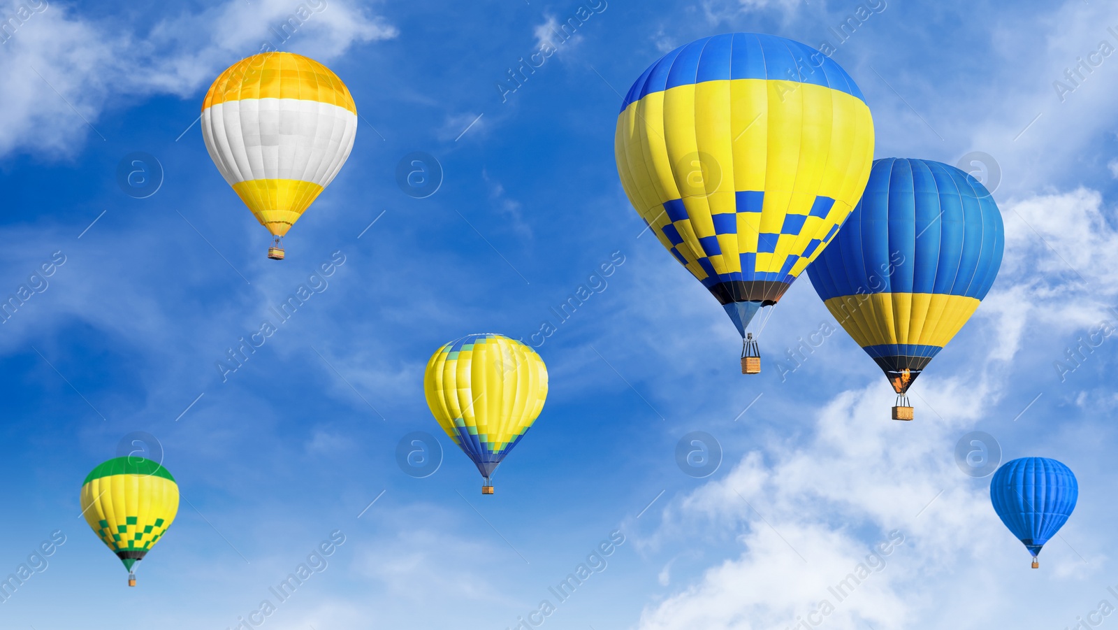 Image of Many bright hot air balloons flying in sky, banner design