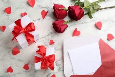 Flat lay composition with gift boxes on marble table. Valentine's Day celebration