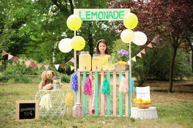 Photo of Little girl at lemonade stand in park
