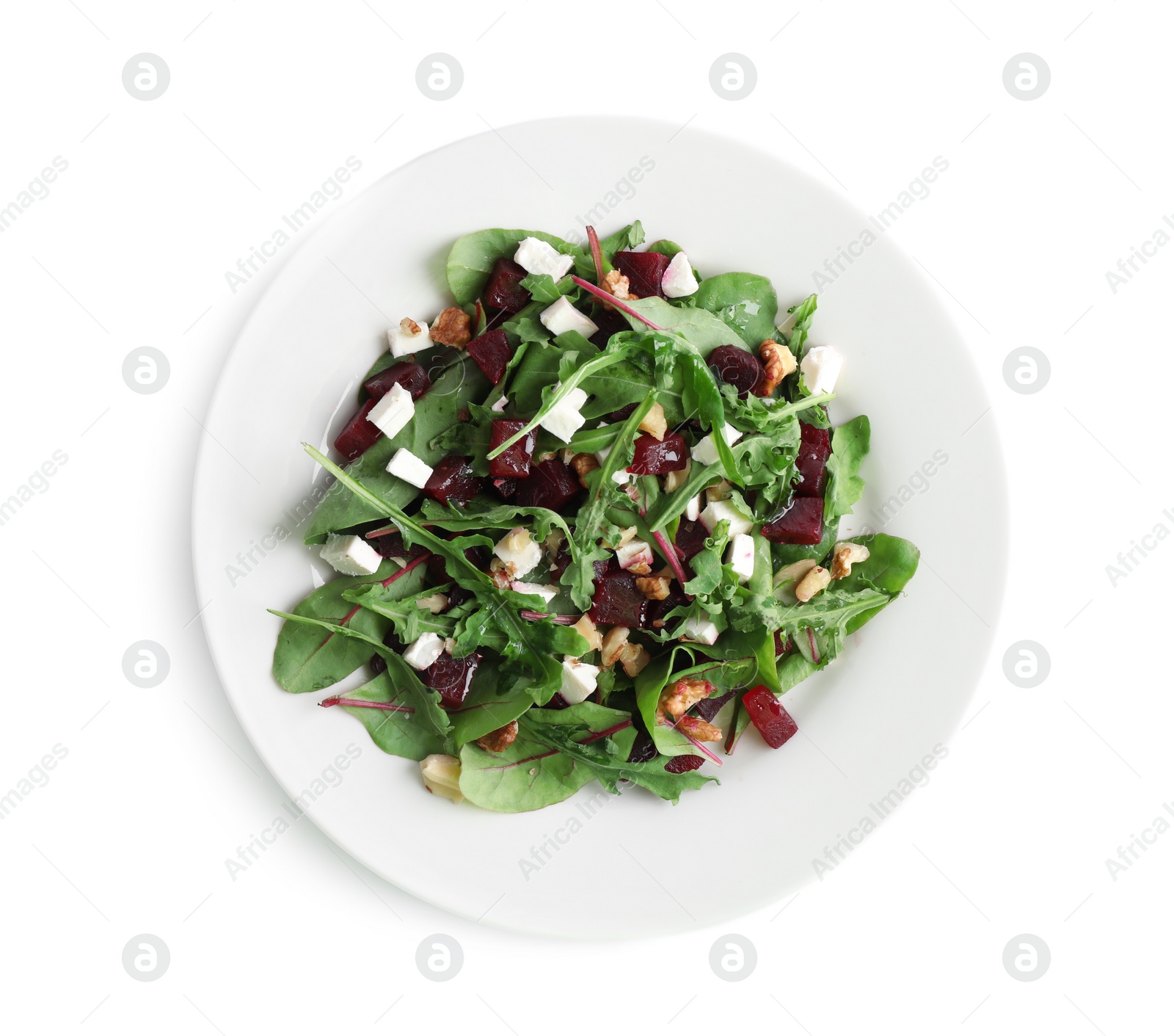 Photo of Delicious beet salad with feta cheese and walnuts isolated on white, top view