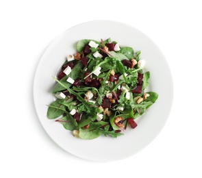 Delicious beet salad with feta cheese and walnuts isolated on white, top view