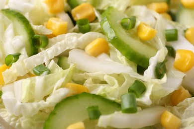 Photo of Tasty salad with Chinese cabbage, corn and cucumber as background, closeup