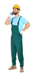 Photo of Professional repairman in uniform talking on smartphone against white background