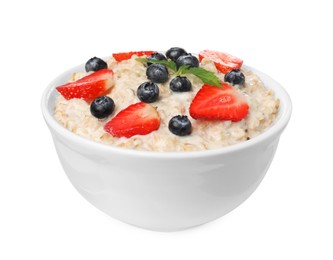 Photo of Tasty boiled oatmeal with berries in bowl isolated on white