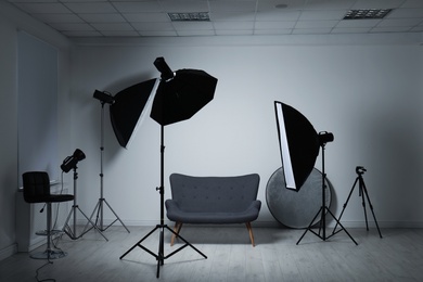 Photo of Modern photo studio with professional lighting equipment