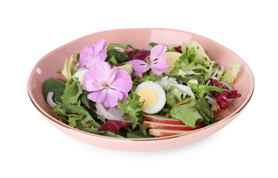Photo of Fresh spring salad with flowers in bowl isolated on white