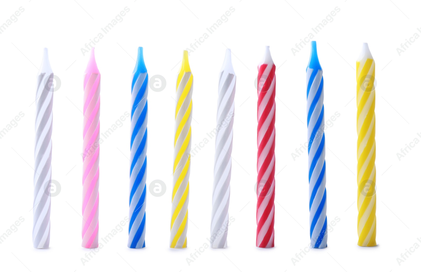 Photo of Set of colorful striped birthday candles isolated on white