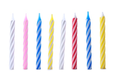 Set of colorful striped birthday candles isolated on white