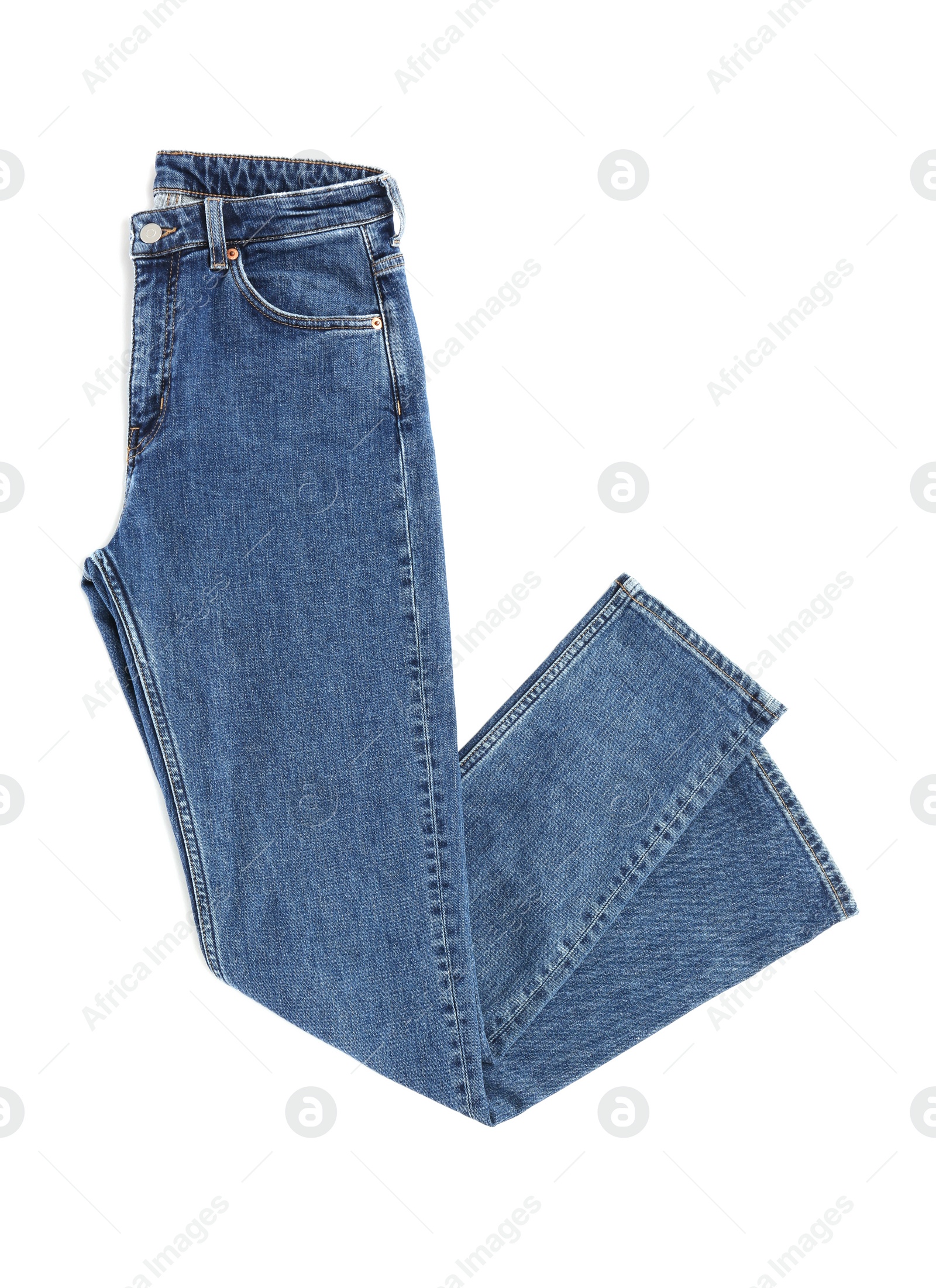 Photo of Dark blue jeans isolated on white, top view. Stylish clothes