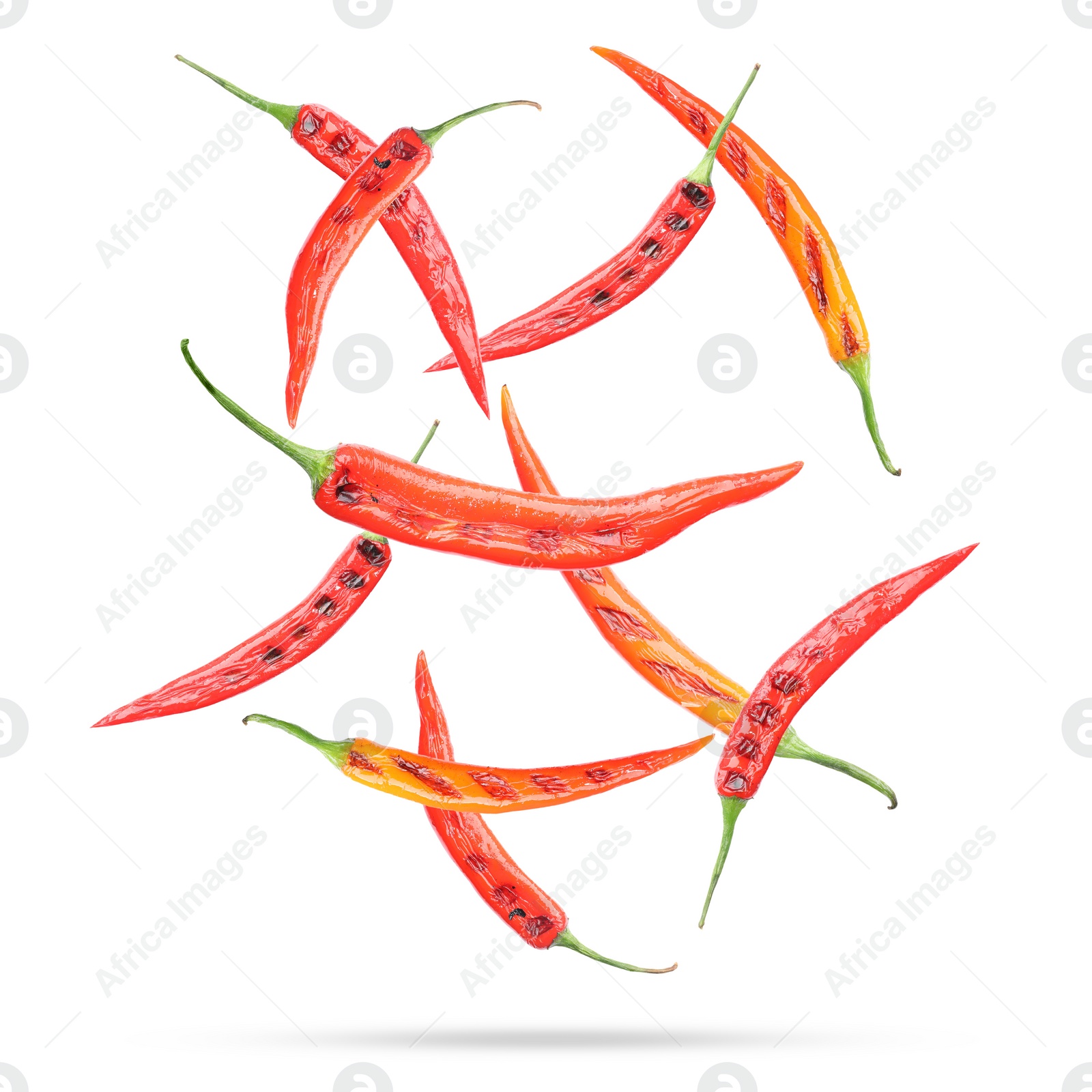 Image of Grilled chili peppers in air on white background