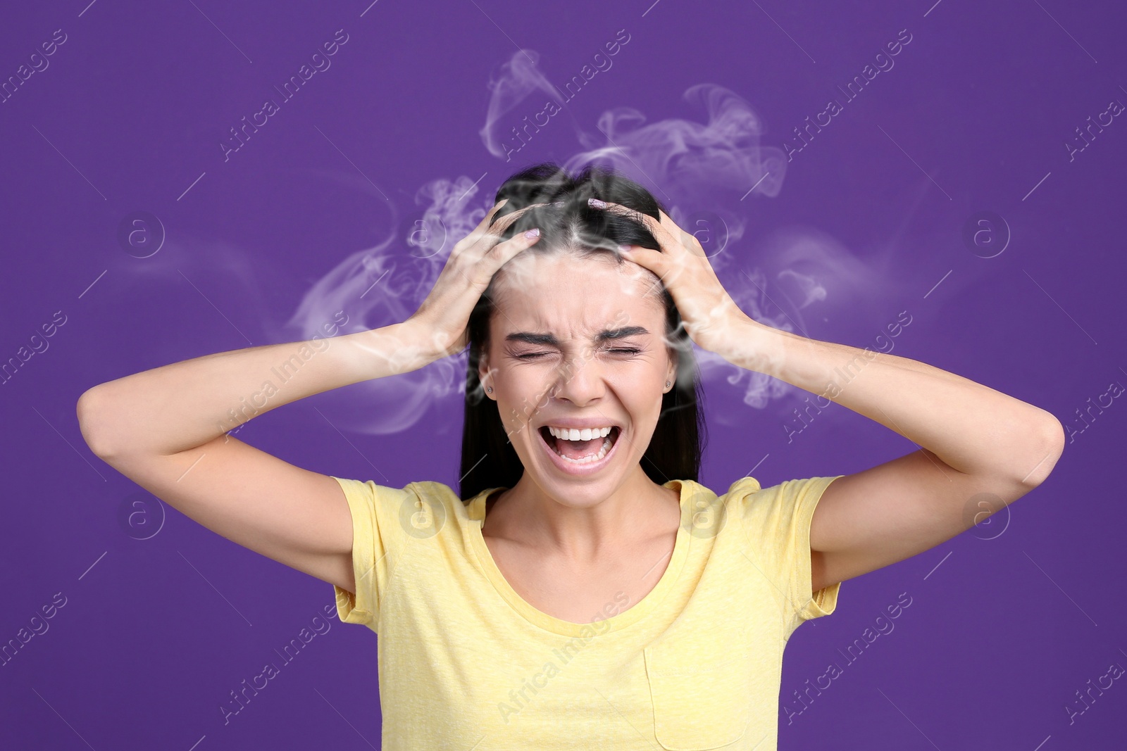 Image of Stressed and upset young woman on violet background