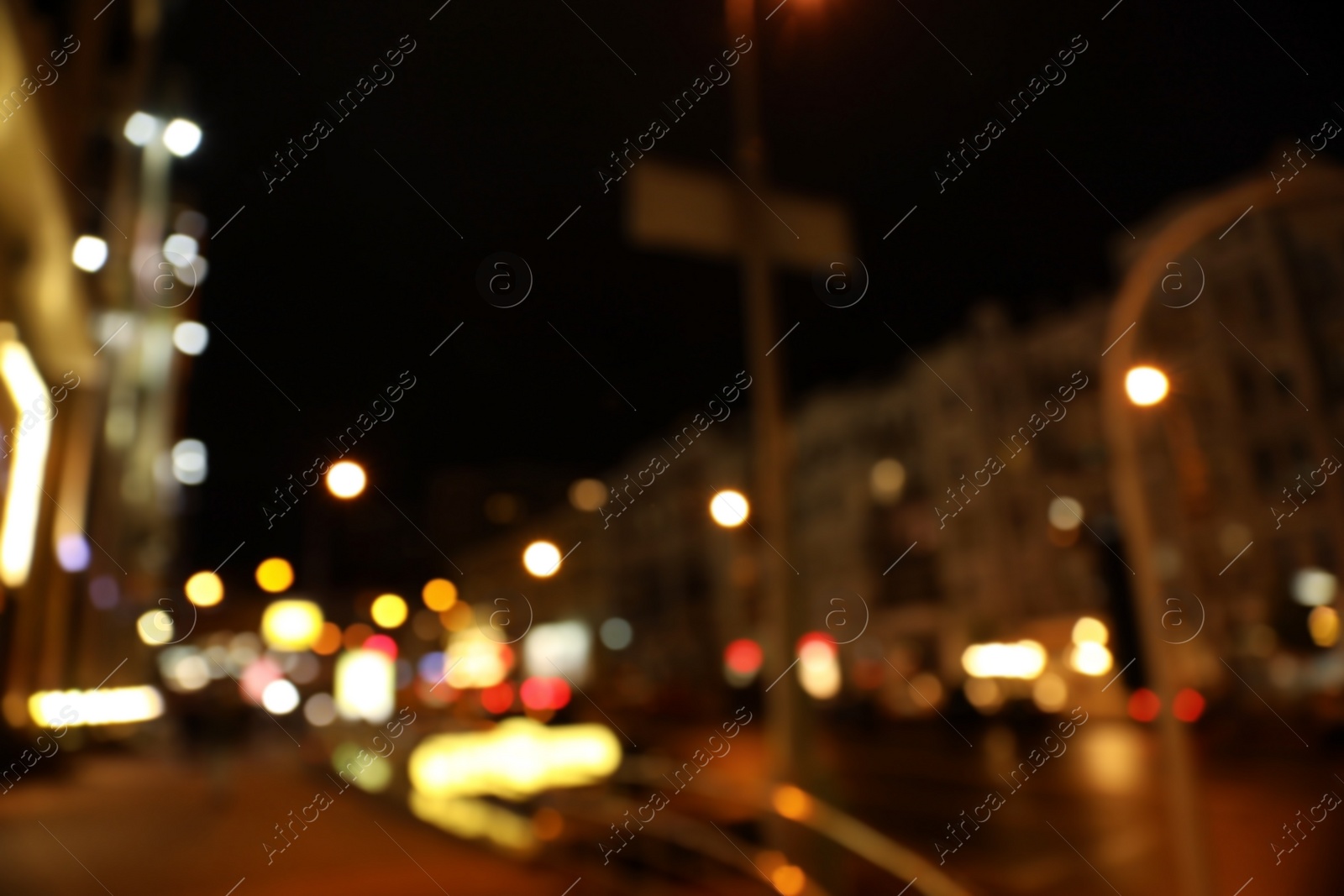 Photo of Blurred view of night cityscape with bokeh effect