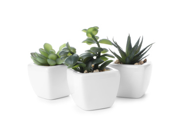 Photo of Beautiful artificial plants in flower pots isolated on white