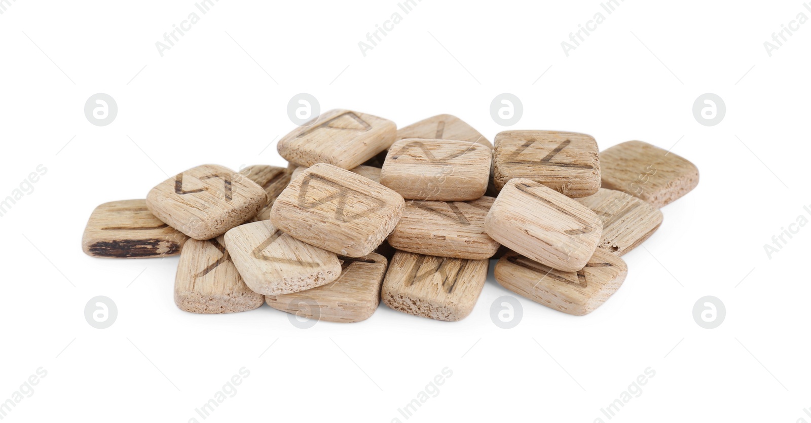 Photo of Pile of wooden runes isolated on white