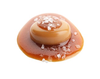 Yummy candy with caramel sauce and sea salt isolated on white