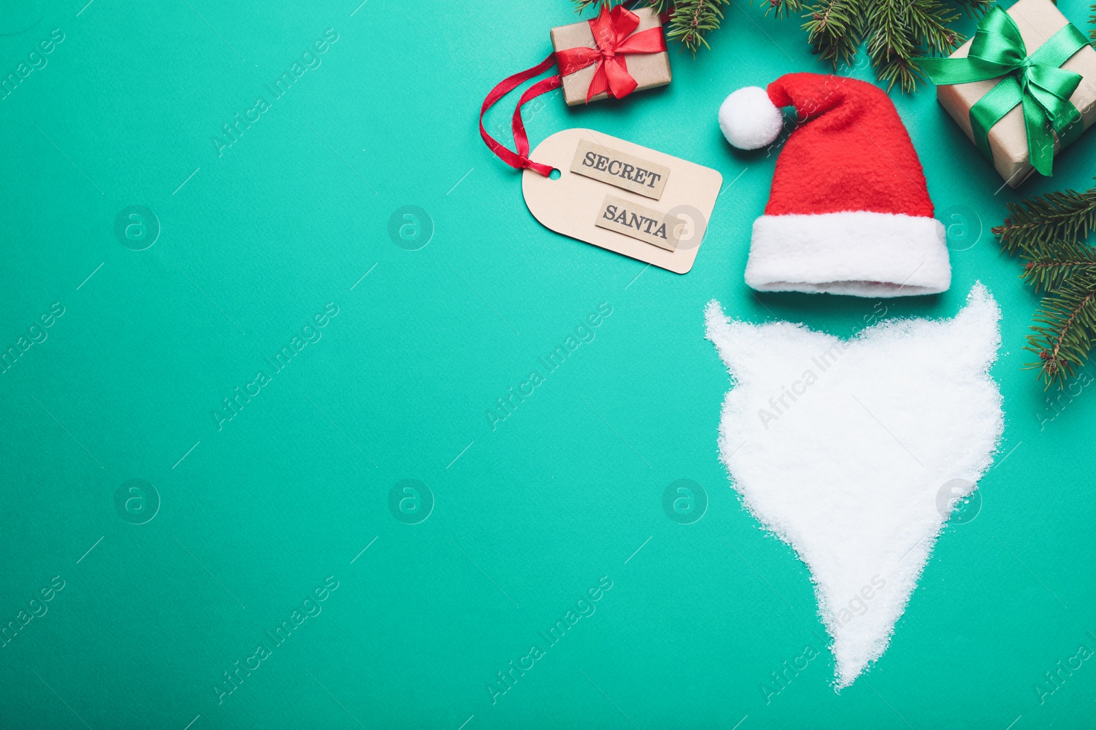 Photo of Flat lay composition with presents from secret Santa on green background, space for text