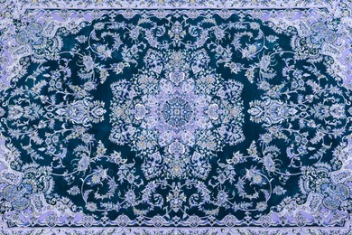 Soft blue carpet with beautiful pattern as background, top view