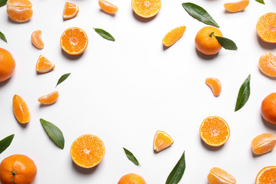 Photo of Frame made of fresh ripe and space for text on white background, top view. Citrus fruit