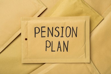 Photo of Words Pension Plan written on envelope, top view