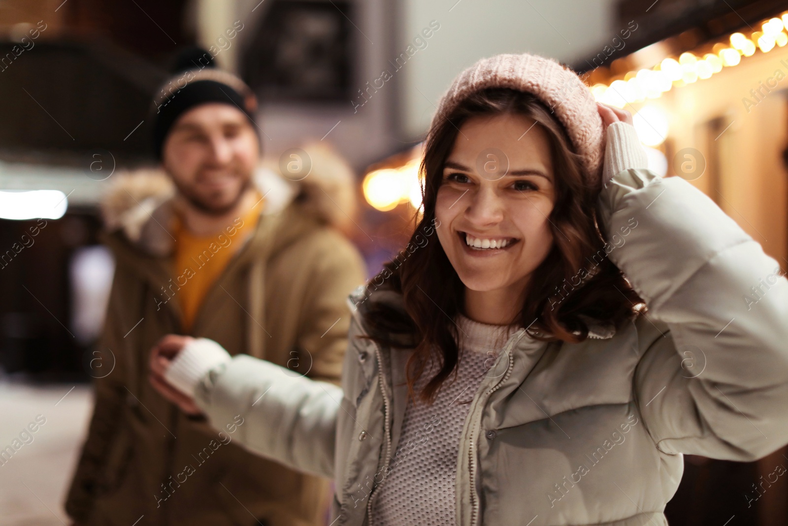 Photo of Lovely couple on city street. Winter vacation