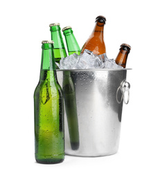 Metal bucket with bottles of beer and ice cubes isolated on white