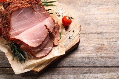 Photo of Delicious ham on wooden table, above view. Christmas dinner