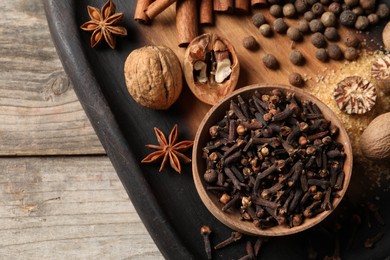 Photo of Different spices on wooden table, top view