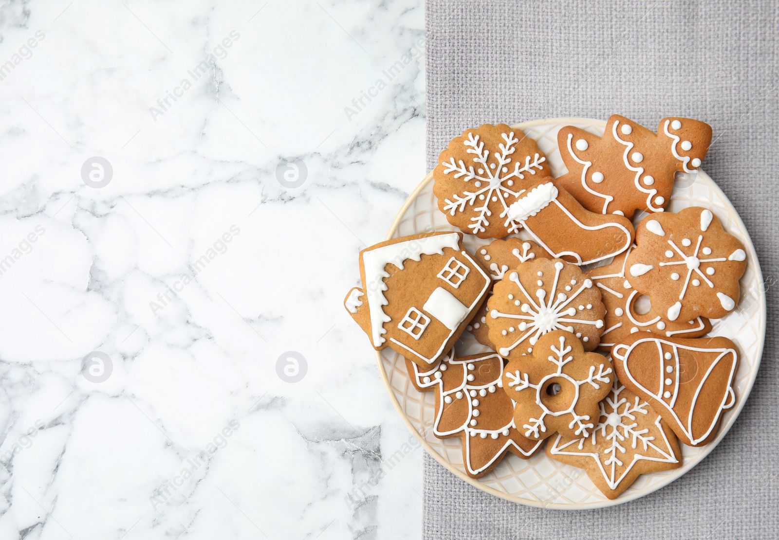 Photo of Plate with tasty homemade Christmas cookies on table, top view