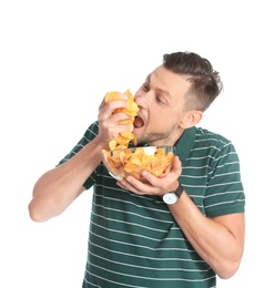 Photo of Man eating potato chips on white background