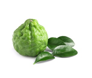 Photo of Fresh ripe bergamot fruit and green leaves on white background
