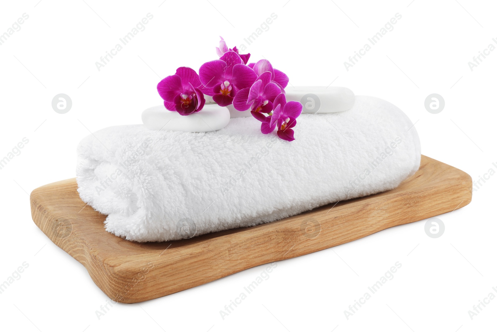 Photo of Board with orchid, spa stones and towel on white background