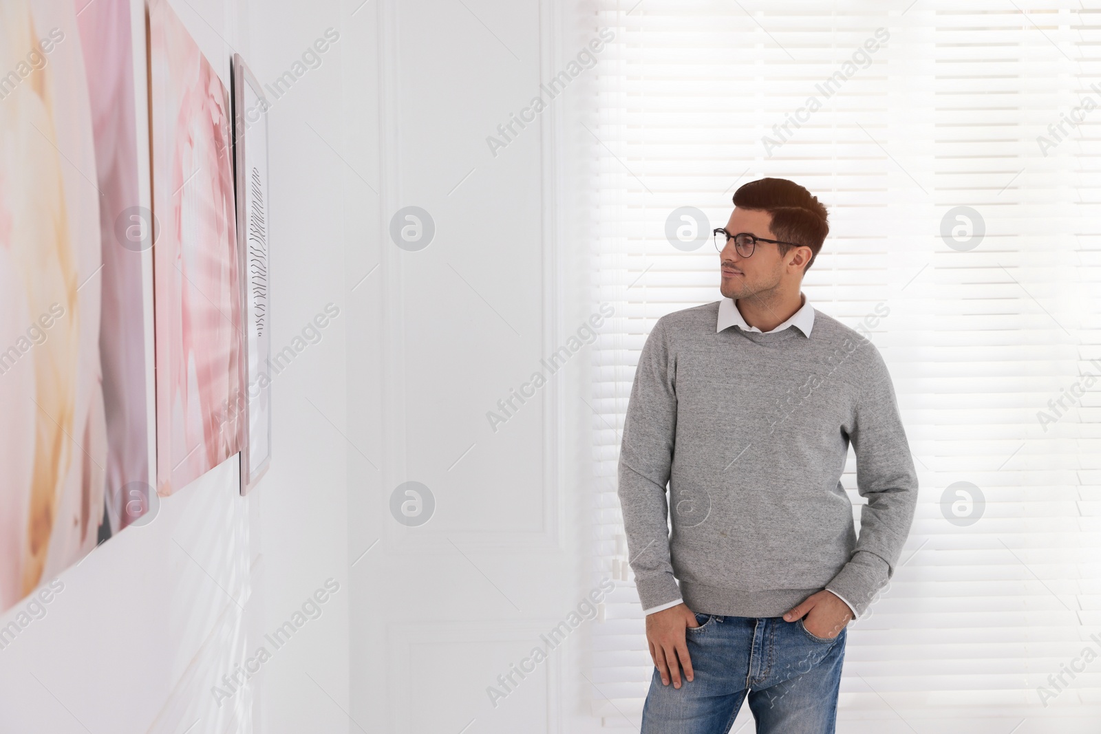 Photo of Thoughtful man at exhibition in art gallery