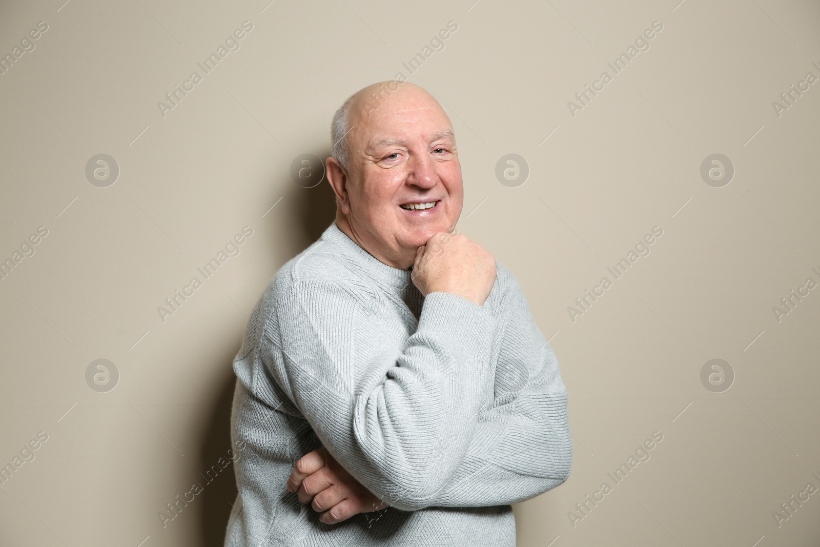 Photo of Portrait of elderly man on color background