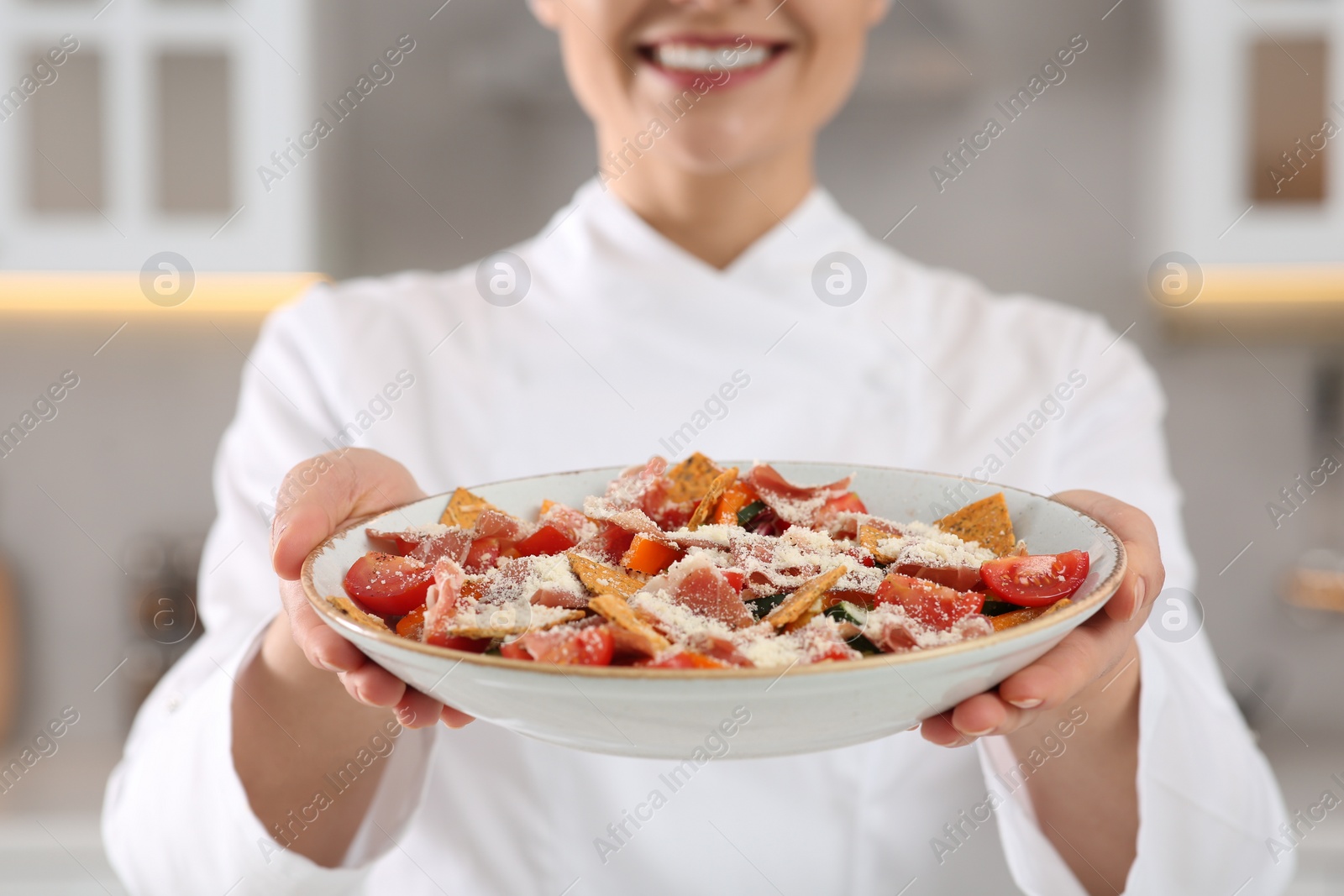 Photo of Closeup of professional chef presenting delicious dish in kitchen, focus on food