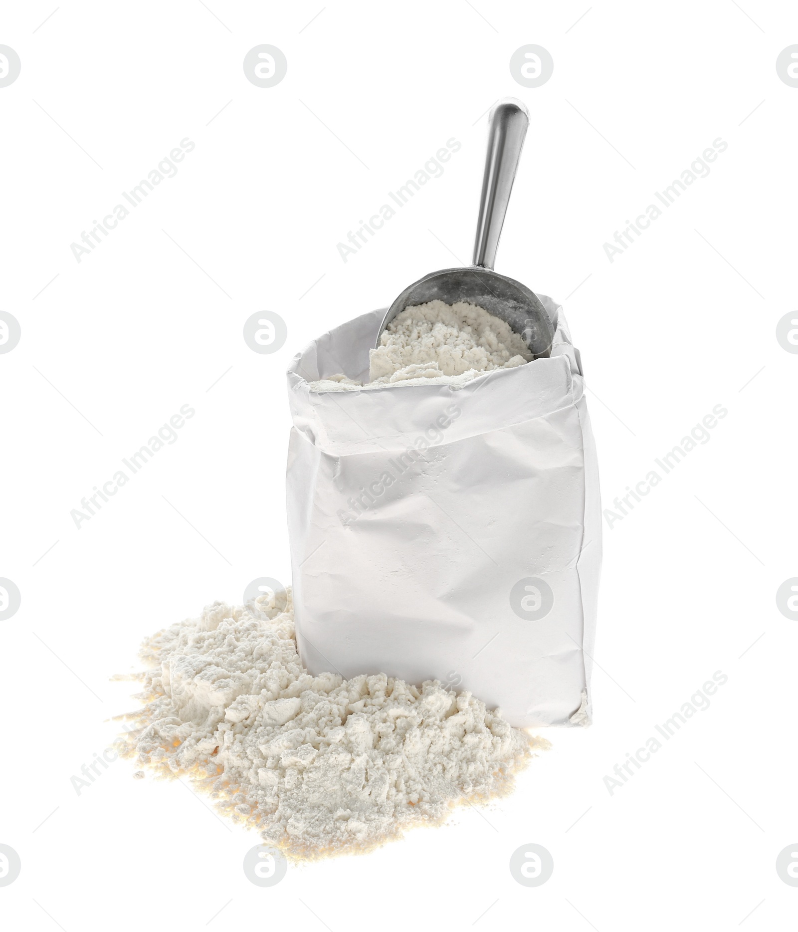 Photo of Organic flour and scoop in paper bag isolated on white