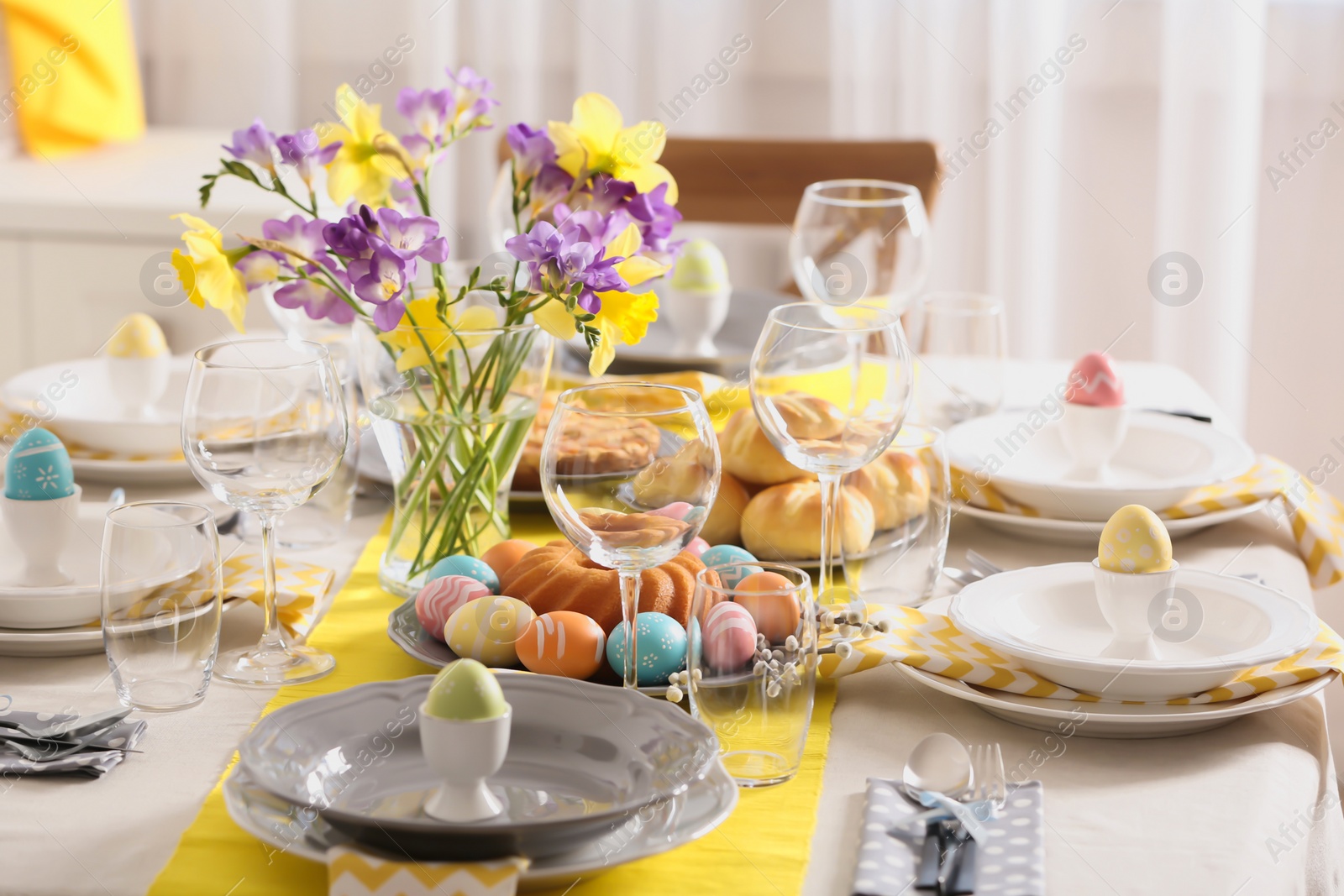 Photo of Festive Easter table setting with traditional meal at home