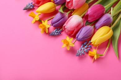 Photo of Beautiful different flowers on pink background, flat lay. Space for text