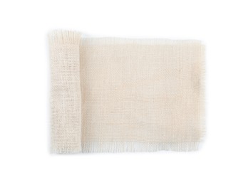 Photo of Roll of burlap fabric isolated on white, top view