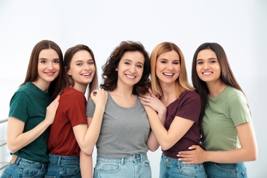 Portrait of happy ladies indoors. Women power concept