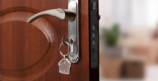 Image of Closeup view of door with key open into room