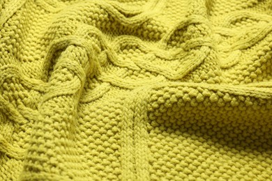 Photo of Texture of soft yellow fabric as background, closeup