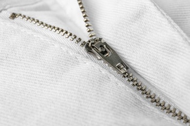 Photo of White jacket with zipper as background, closeup view